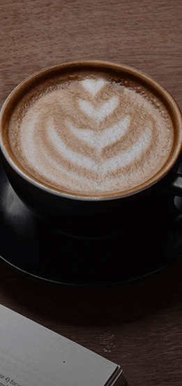 A cup of coffee sitting on a table